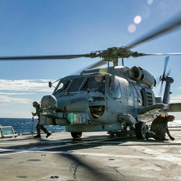 Helicopter landing on naval vessel