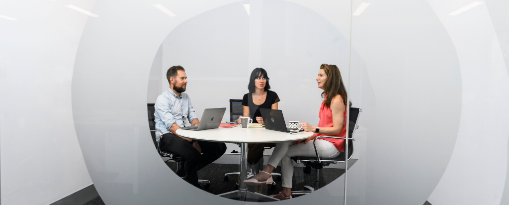 Three members sit at the nandin Deep Technology Hub at ANSTO's Lucas Heights campus.