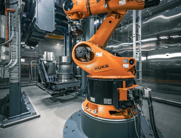 Integrated hot isostatic press with robotic arm 